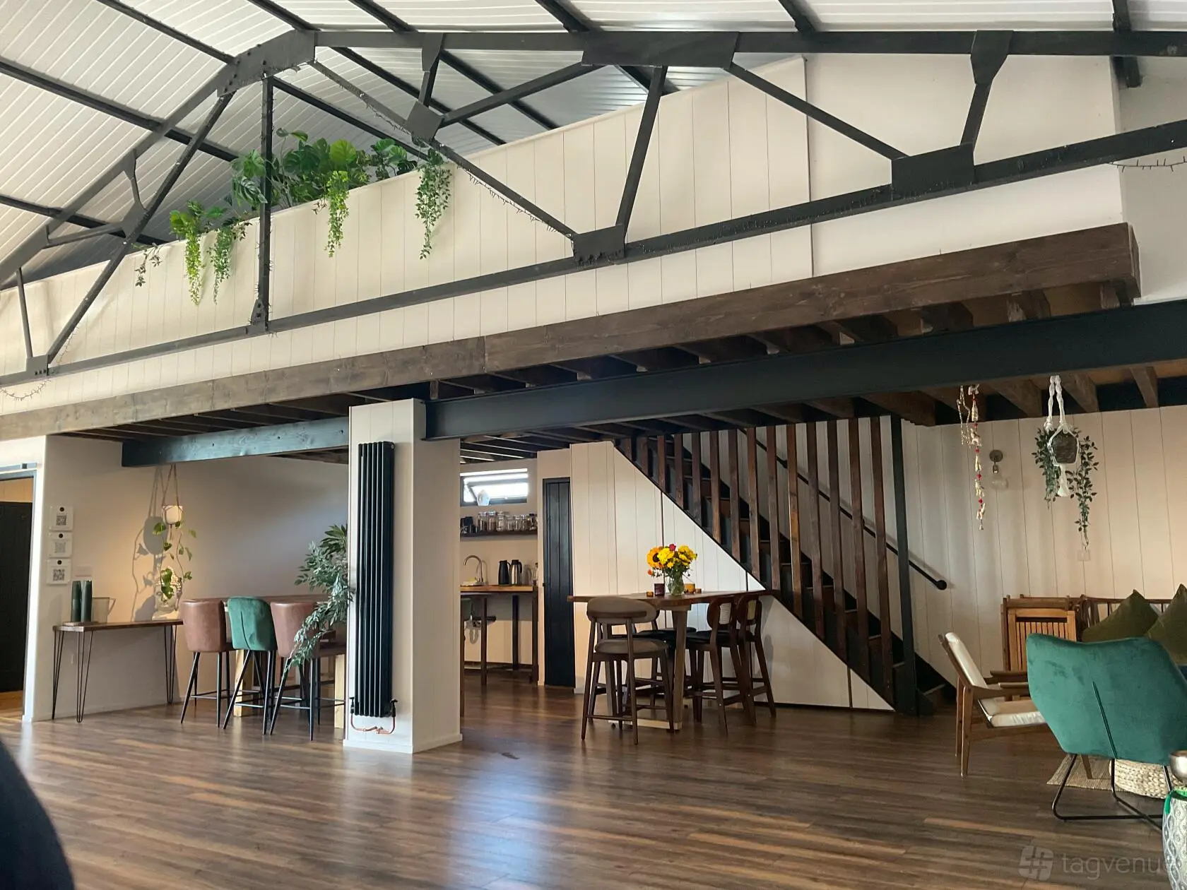 The open room, dining area and mezzanine staircase