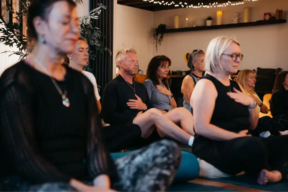 A group taking part in a calming wellbeing session